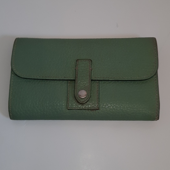 Dooney and bourke wallet with pen.